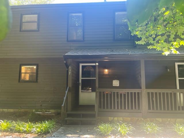 a view of a house with a small porch