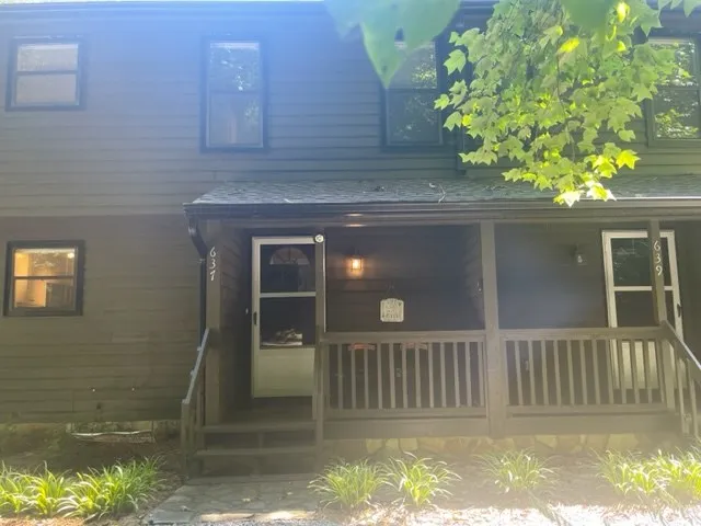 a front view of a house with a porch