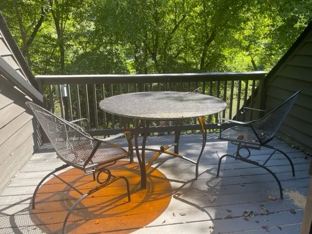 a view of a balcony with furniture
