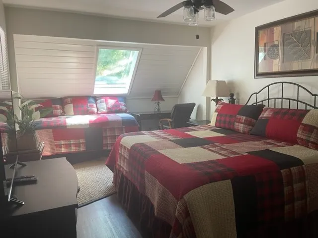 a bedroom with bed and window