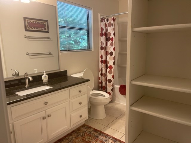 637 Riverside Drive Ellijay, GA 30540 - Photo 10 of 17 a bathroom with a granite countertop toilet a sink and a bathtub