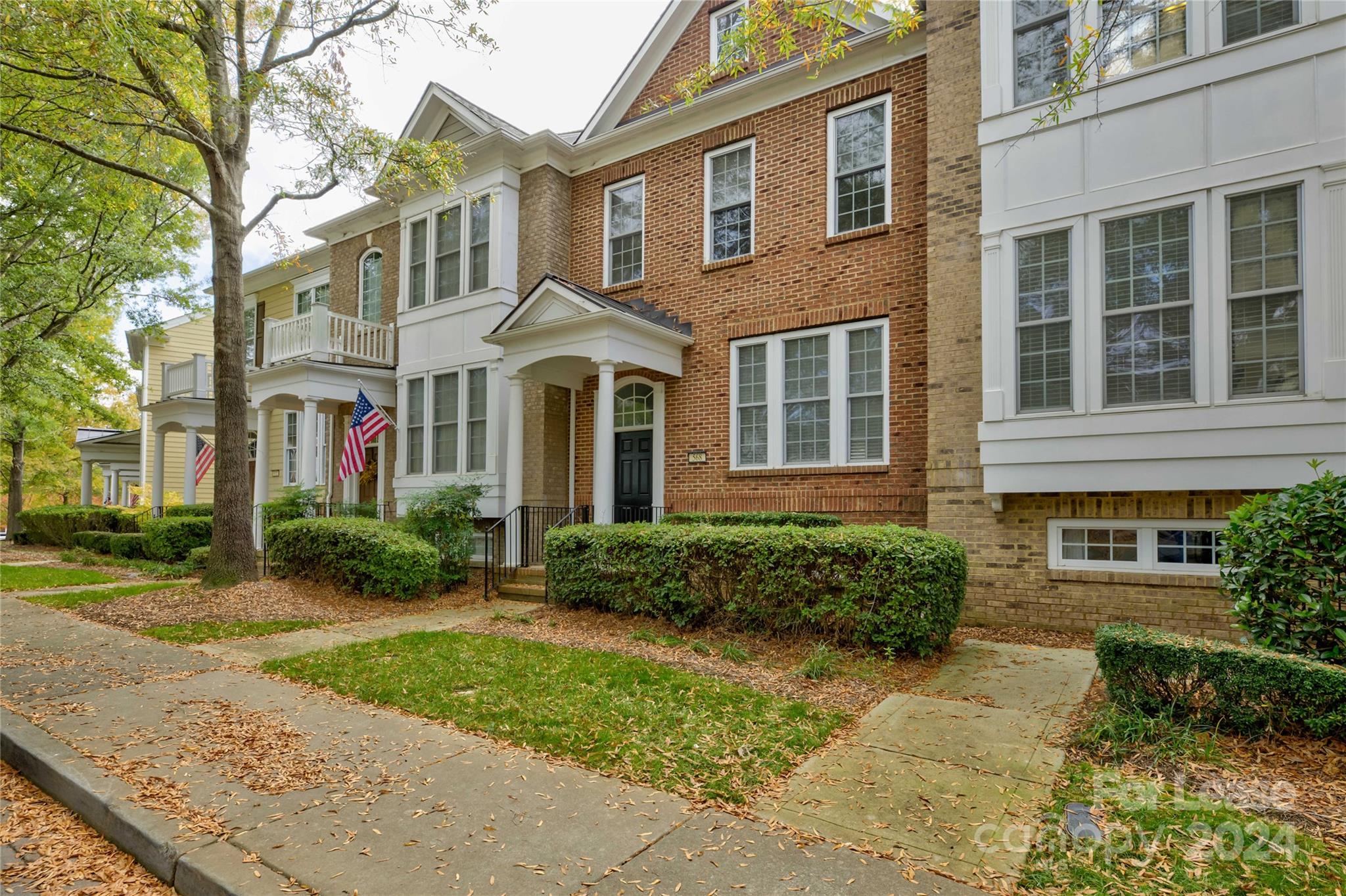 568 6th Baxter Crossing Fort Mill, SC 29708 - Photo 1 of 48 front view of a brick house with a yard