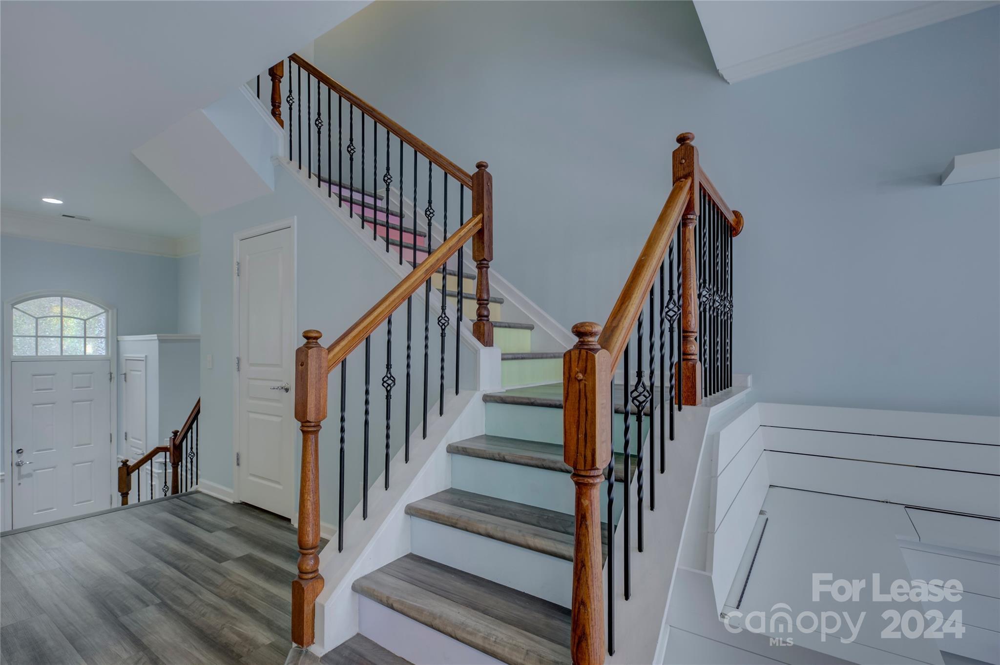 568 6th Baxter Crossing Fort Mill, SC 29708 - Photo 24 of 48 a view of staircase with wooden floor and a chandelier