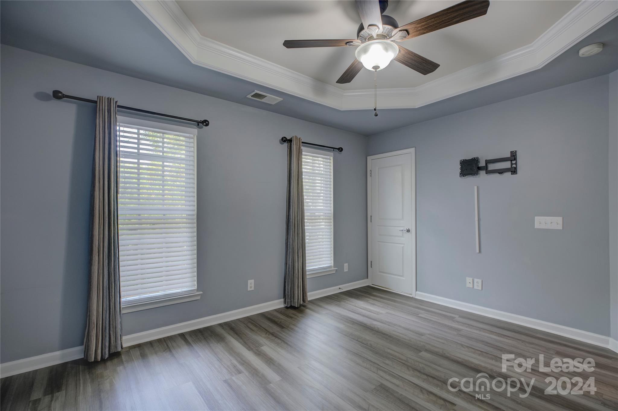 568 6th Baxter Crossing Fort Mill, SC 29708 - Photo 27 of 48 a view of empty room with wooden floor and fan