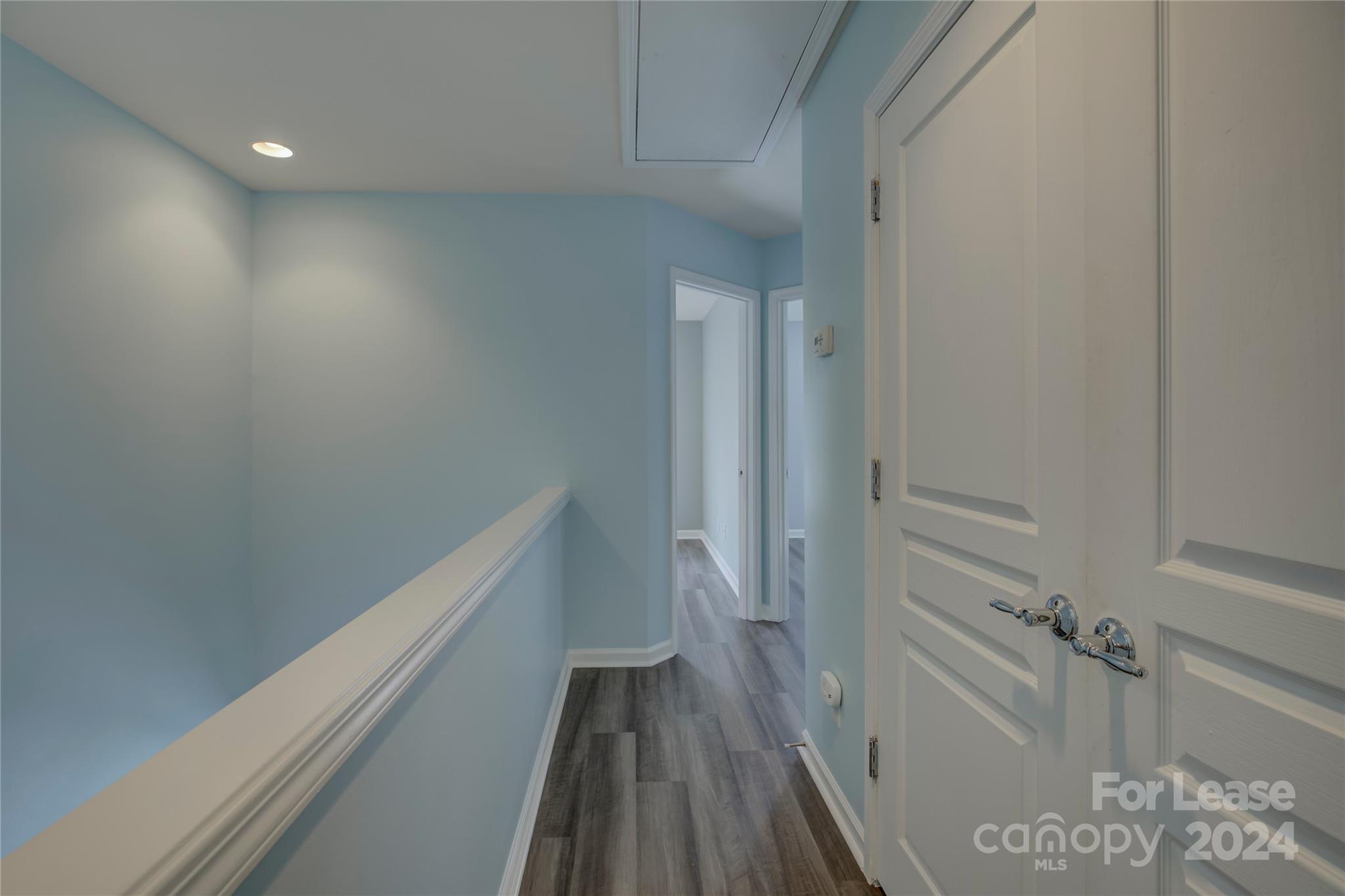 568 6th Baxter Crossing Fort Mill, SC 29708 - Photo 31 of 48 a view of a hallway with wooden floor and staircase