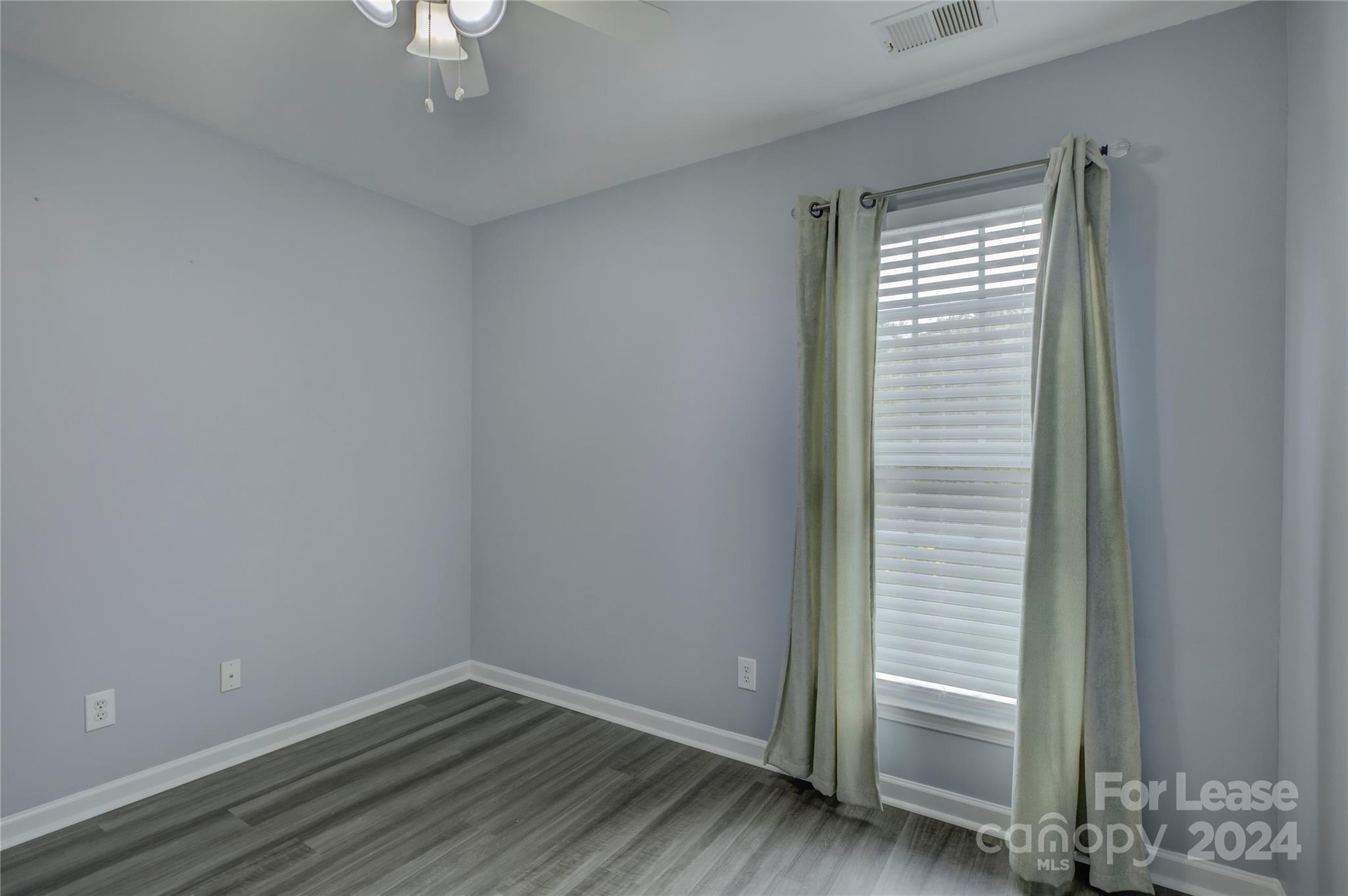 568 6th Baxter Crossing Fort Mill, SC 29708 - Photo 37 of 48 wooden floor in an empty room with a window