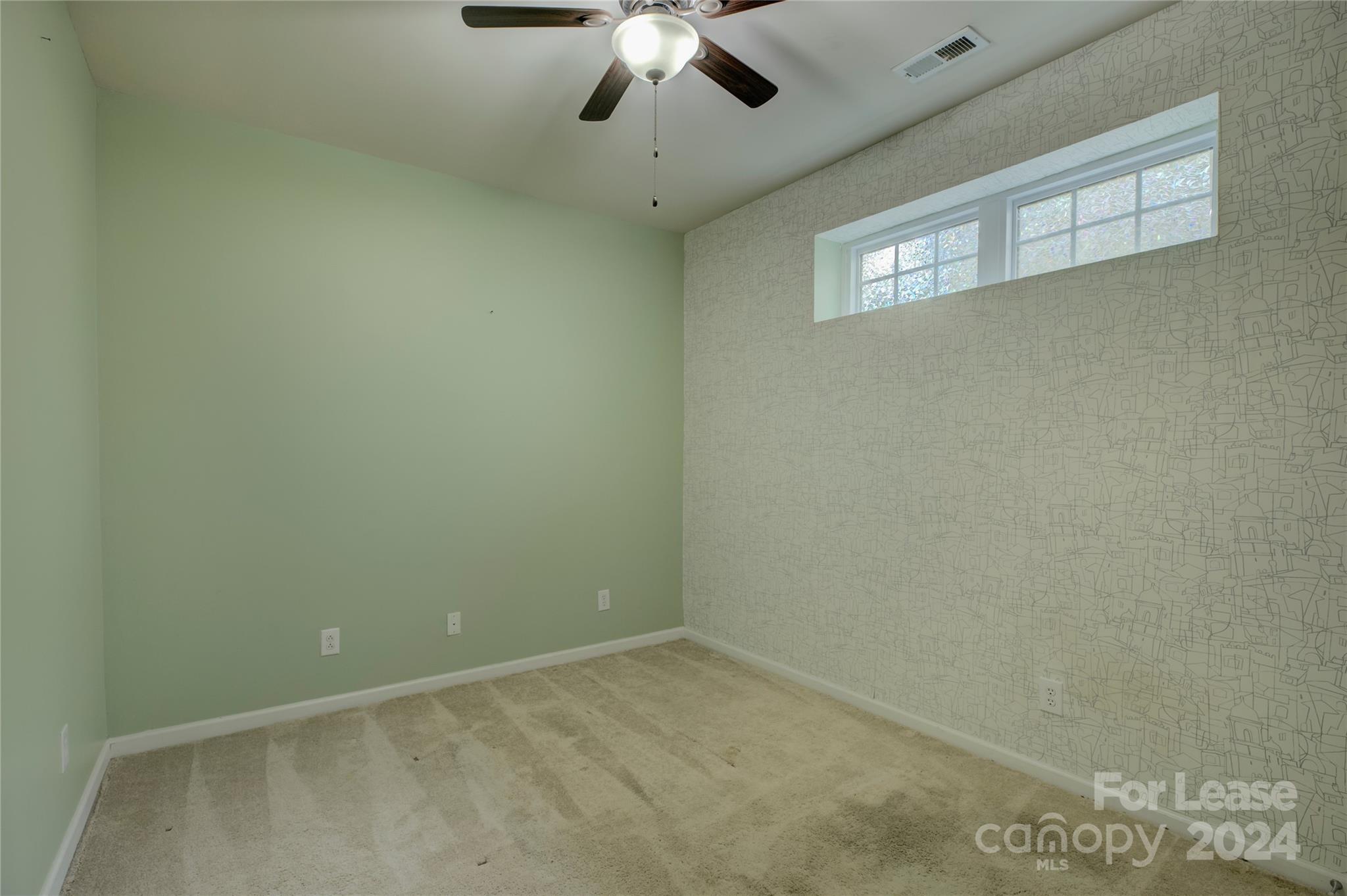 568 6th Baxter Crossing Fort Mill, SC 29708 - Photo 39 of 48 an empty room with a ceiling fan and window
