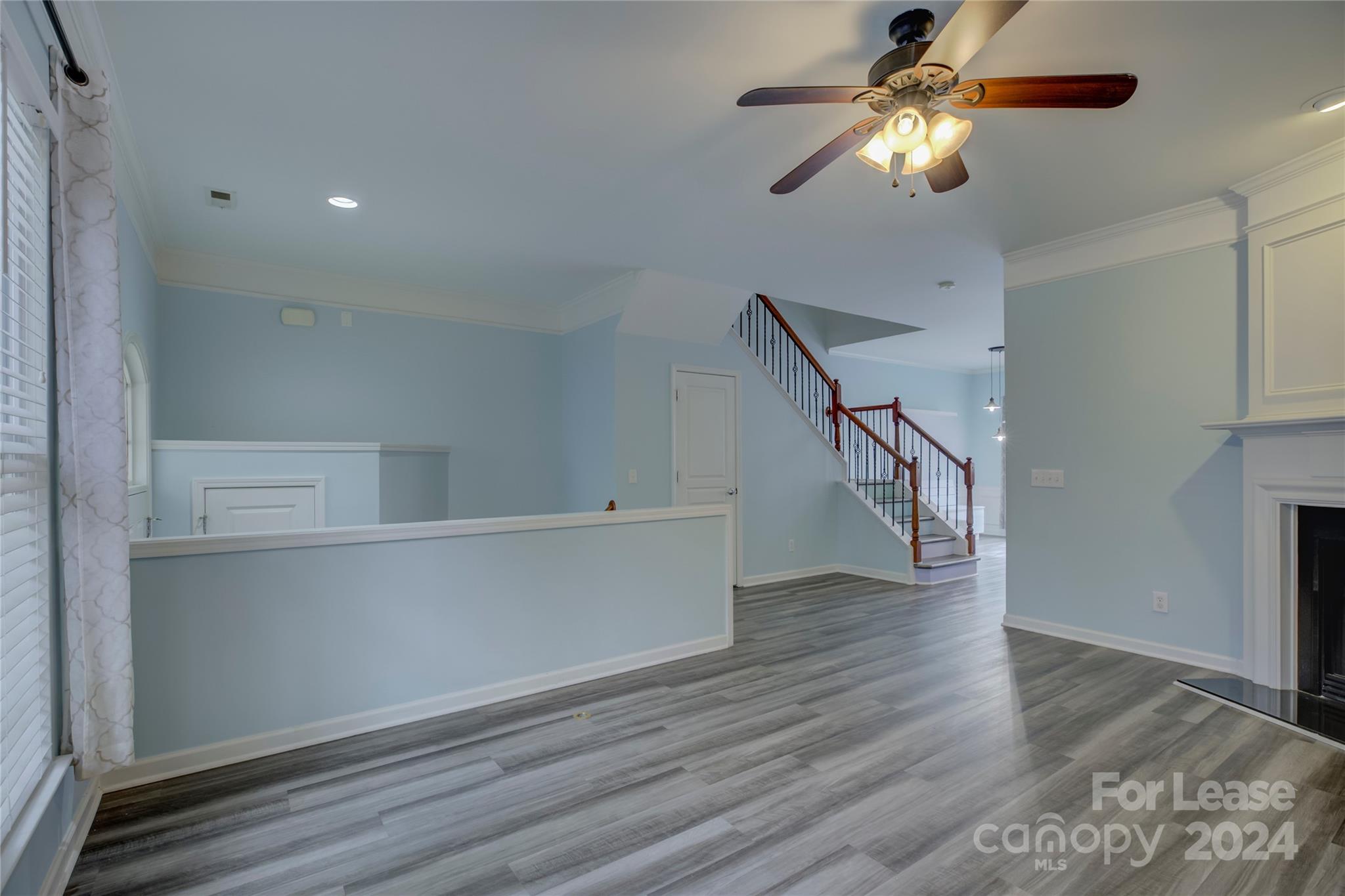 568 6th Baxter Crossing Fort Mill, SC 29708 - Photo 7 of 48 a view of empty room with wooden floor and fan