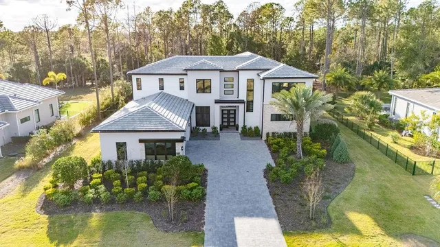 a view of swimming pool with palm trees