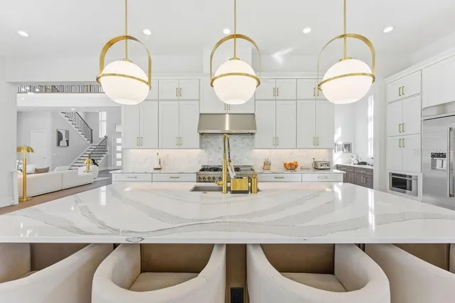 a view of walk in closet with clothes