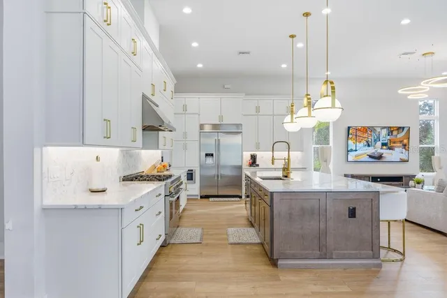 a bathroom with a tub sink and glass door