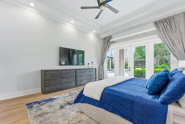 a bedroom with a bed and a cabinets