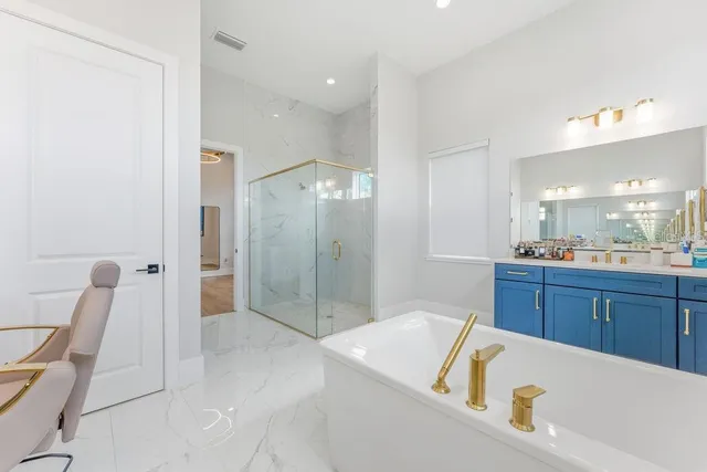 a bathroom with a sink vanity mirror and toilet