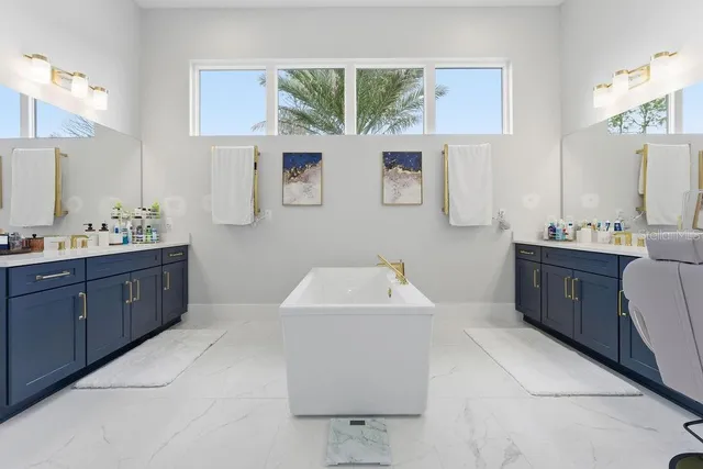 a bathroom with a granite countertop sink a toilet and shower