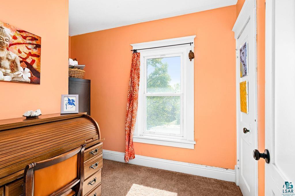23 5th Street Proctor, MN 55810 - Photo 17 of 32 Bedroom featuring light carpet and multiple windows