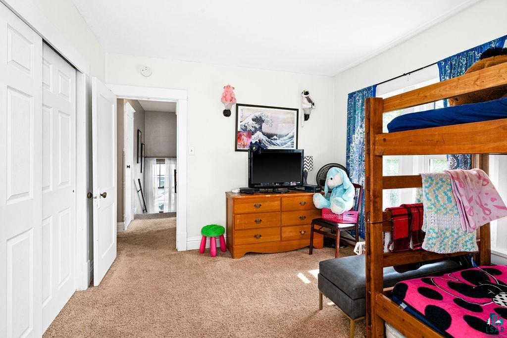 23 5th Street Proctor, MN 55810 - Photo 19 of 32 Carpeted bedroom with a closet