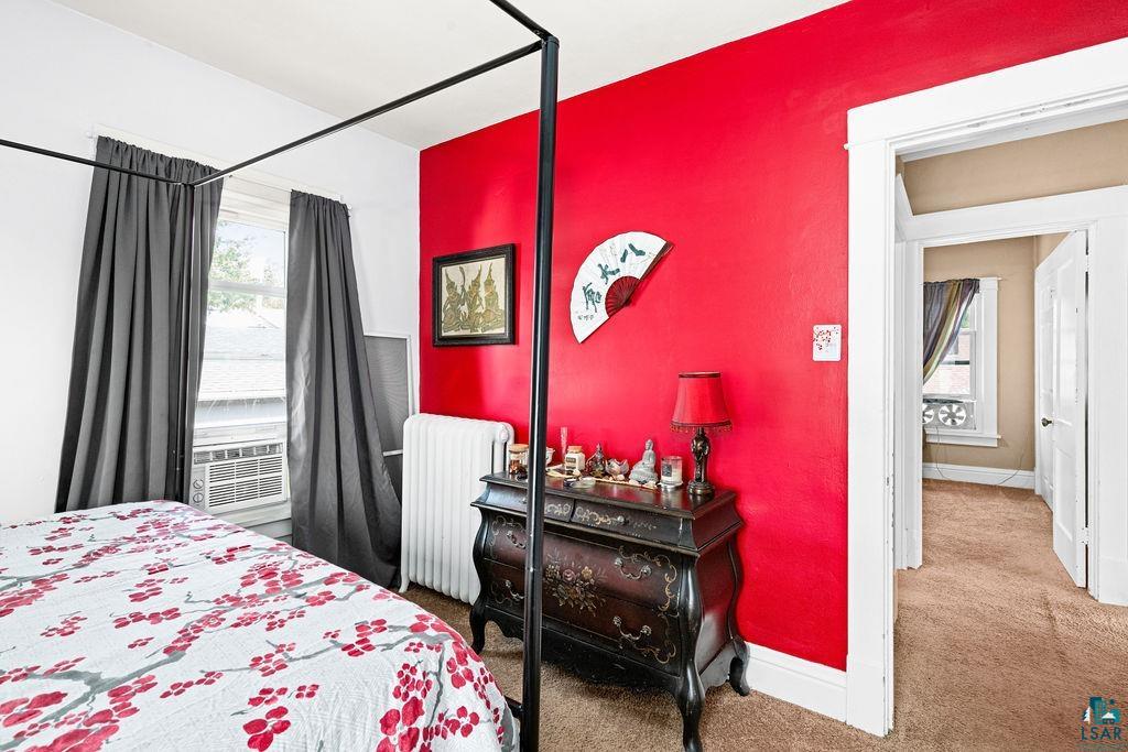 23 5th Street Proctor, MN 55810 - Photo 21 of 32 Bedroom with radiator heating unit and carpet