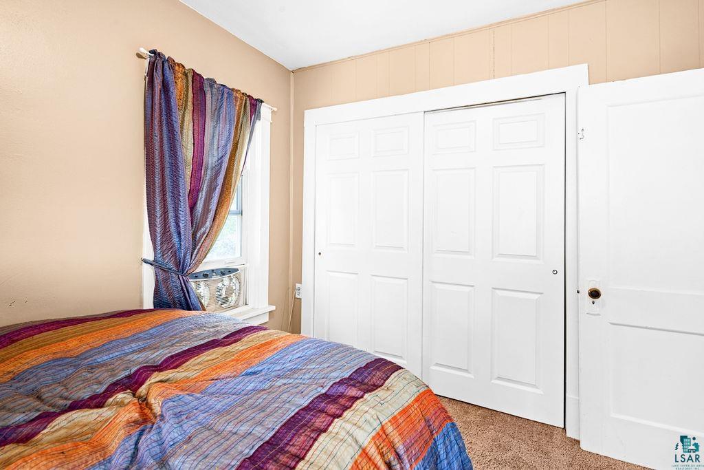 23 5th Street Proctor, MN 55810 - Photo 24 of 32 Bedroom with a closet and carpet flooring