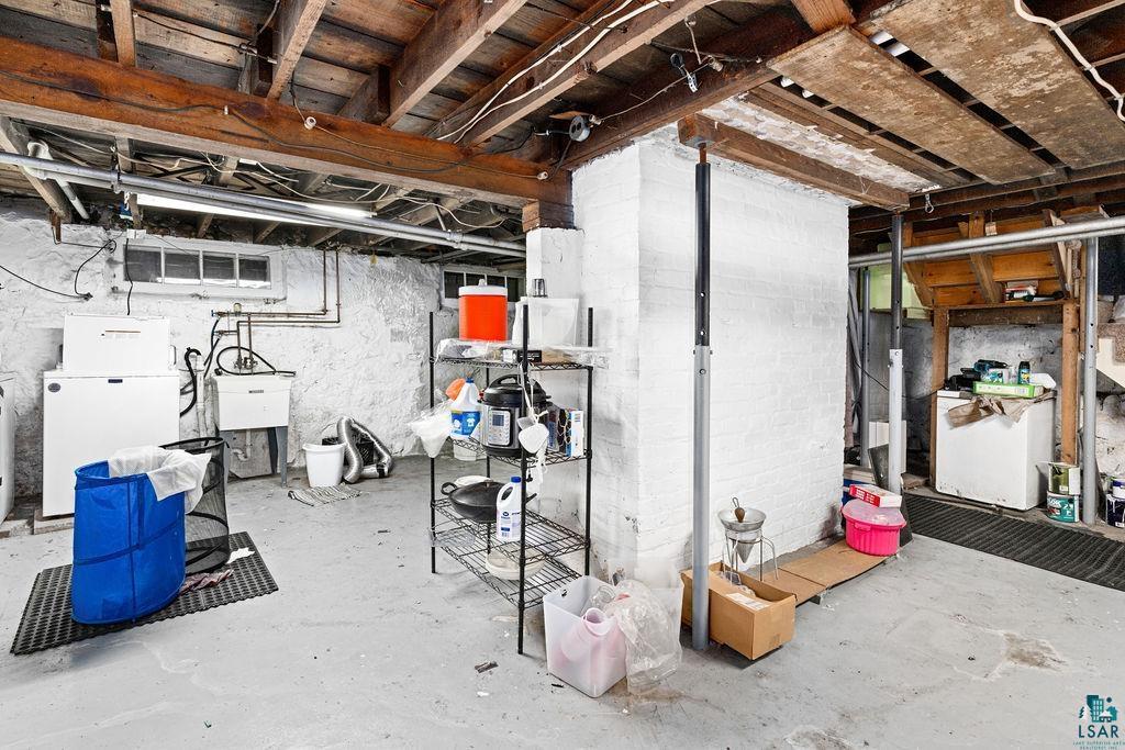 23 5th Street Proctor, MN 55810 - Photo 25 of 32 Basement with white refrigerator