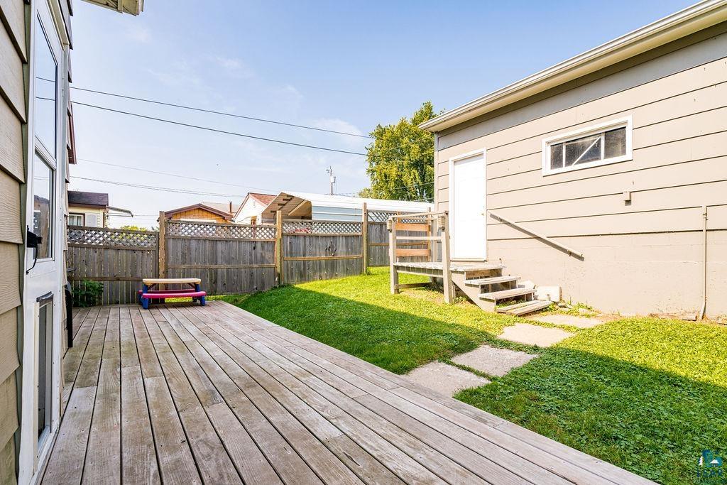 23 5th Street Proctor, MN 55810 - Photo 28 of 32 Wooden deck with a yard