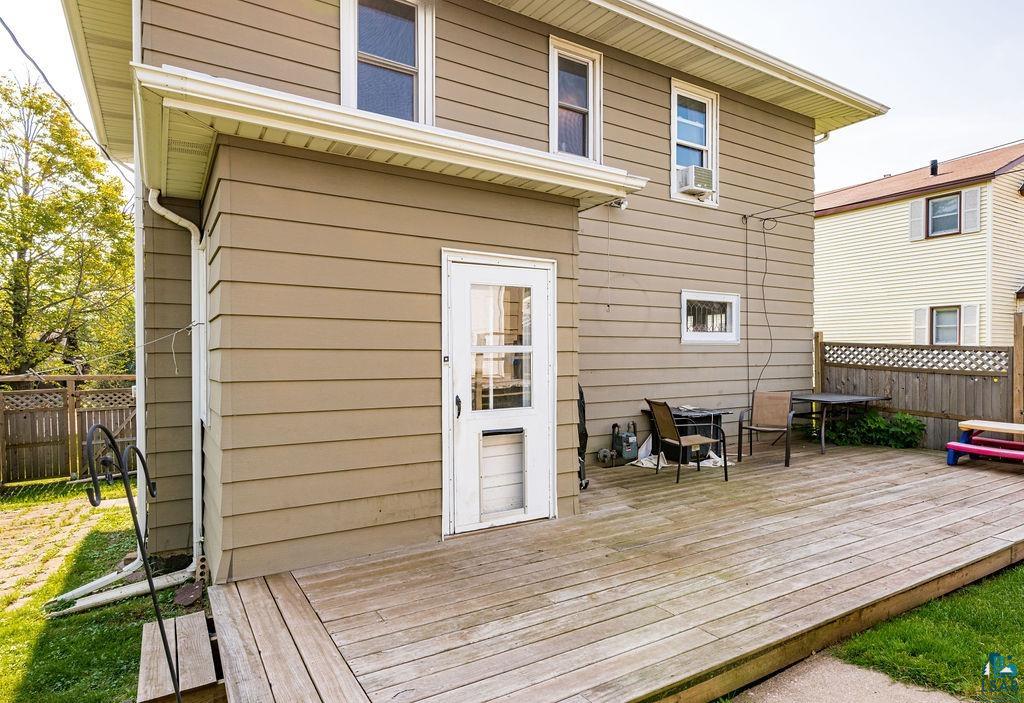23 5th Street Proctor, MN 55810 - Photo 29 of 32 Wooden deck with cooling unit