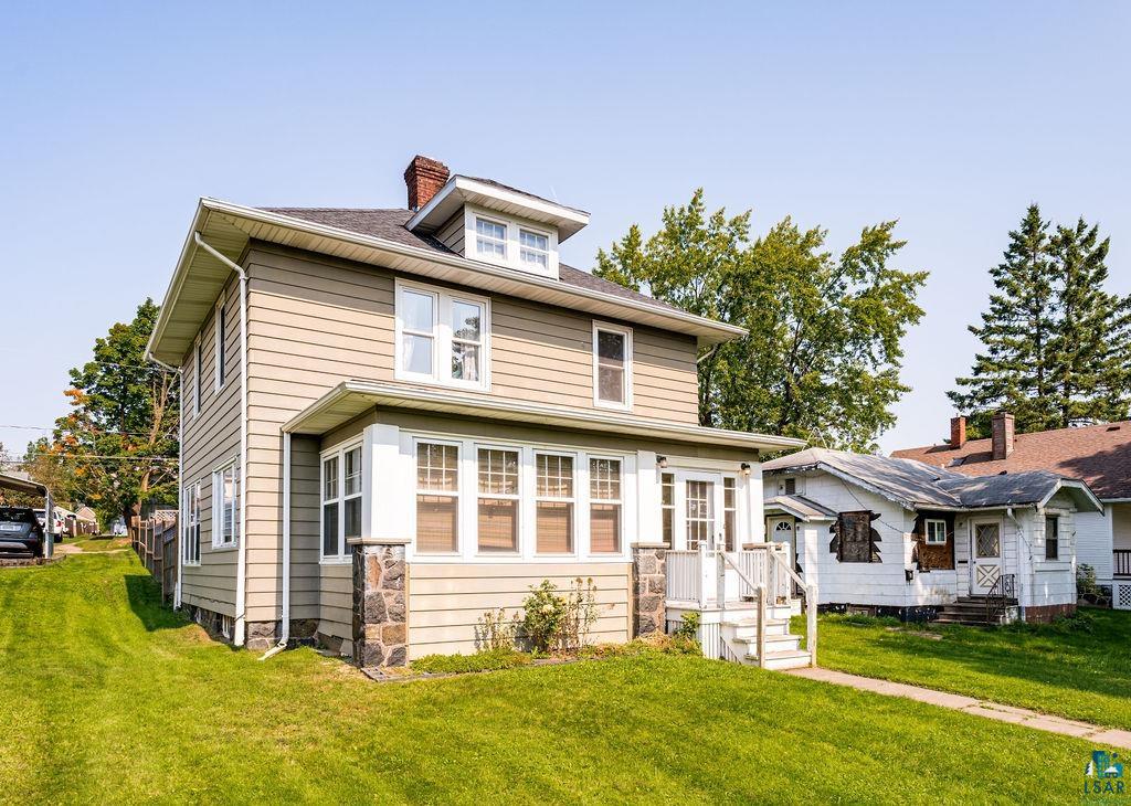 23 5th Street Proctor, MN 55810 - Photo 3 of 32 View of front of house featuring a front lawn