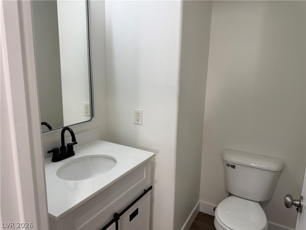 1141 Cathedral Ridge Street Henderson, NV 89052 - Photo 64 of 77 This bathroom features sleek design with modern fixtures and a clean aesthetic.