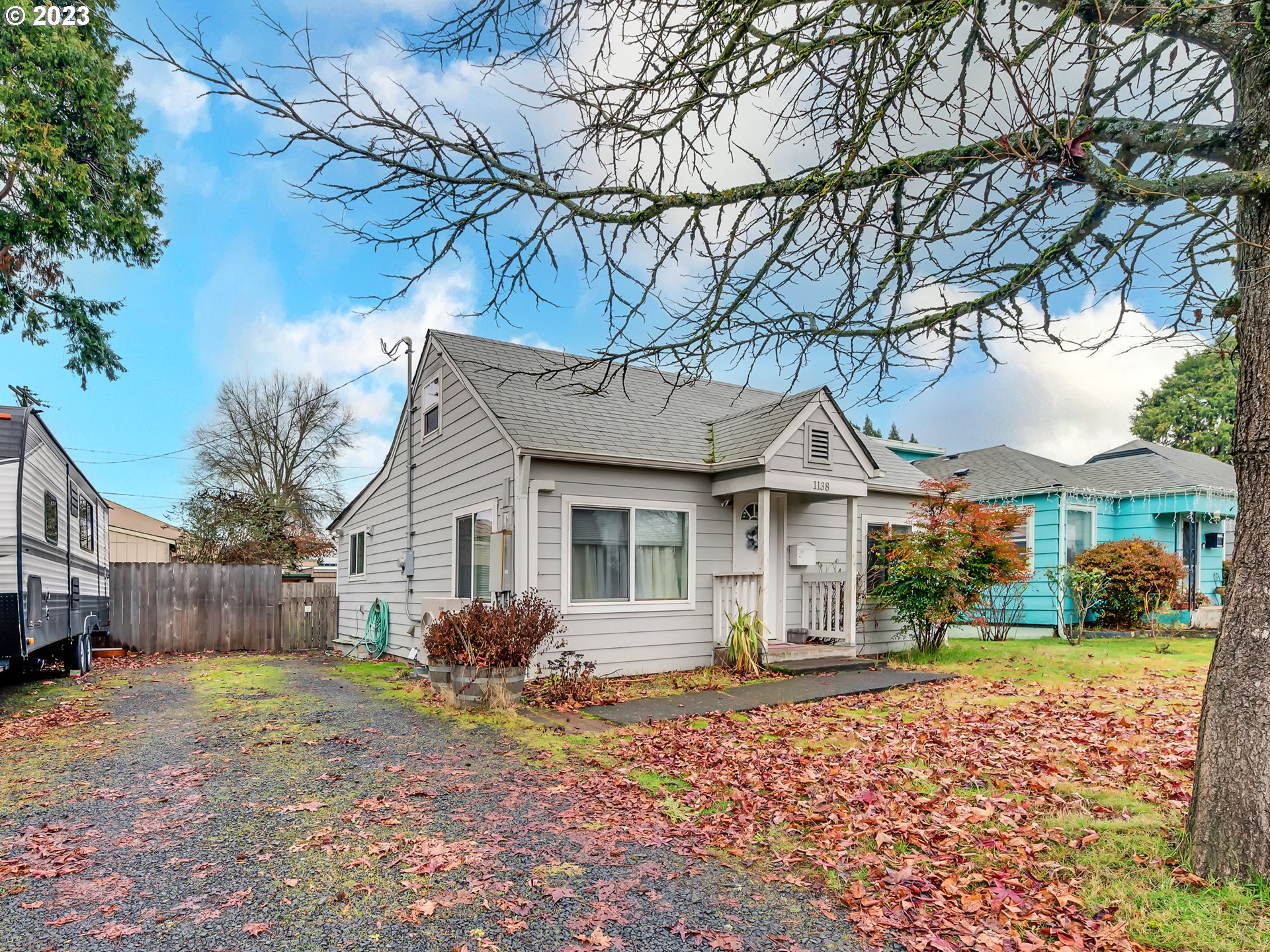 1138 F Street Springfield, OR 97477 - Photo 3 of 30 a front view of a house with a yard and garage