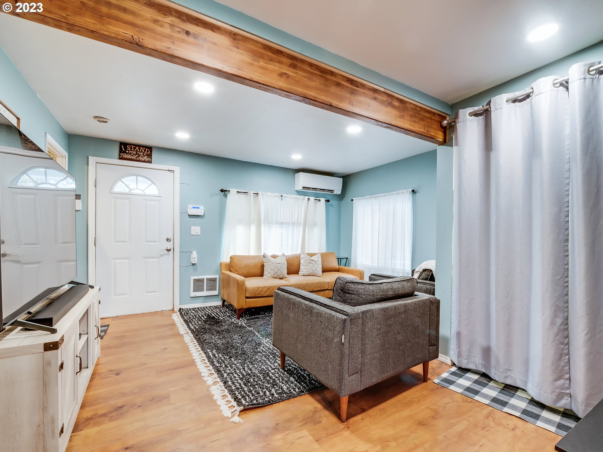 1138 F Street Springfield, OR 97477 - Photo 8 of 30 a room with furniture and a rug