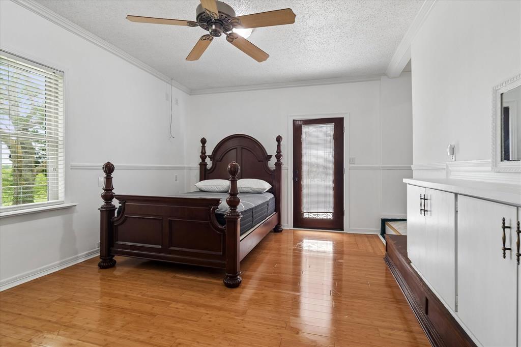 3007 McReynolds Road Sanger, TX 76266 - Photo 12 of 39 Bright interior with wood-finish flooring, a ceiling fan with light fixture, and a window with blinds