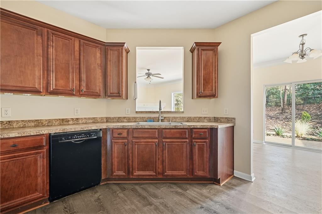 404 Sheila Way Canton, GA 30114 - Photo 11 of 36 a bathroom with a granite countertop sink and a mirror