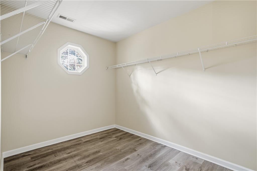 404 Sheila Way Canton, GA 30114 - Photo 14 of 36 a view of a small space with wooden floor and a window
