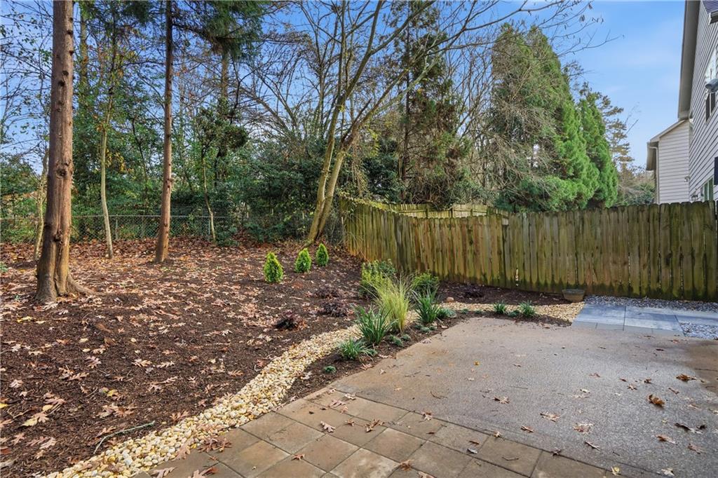 404 Sheila Way Canton, GA 30114 - Photo 17 of 36 a backyard of a house with lots of green space