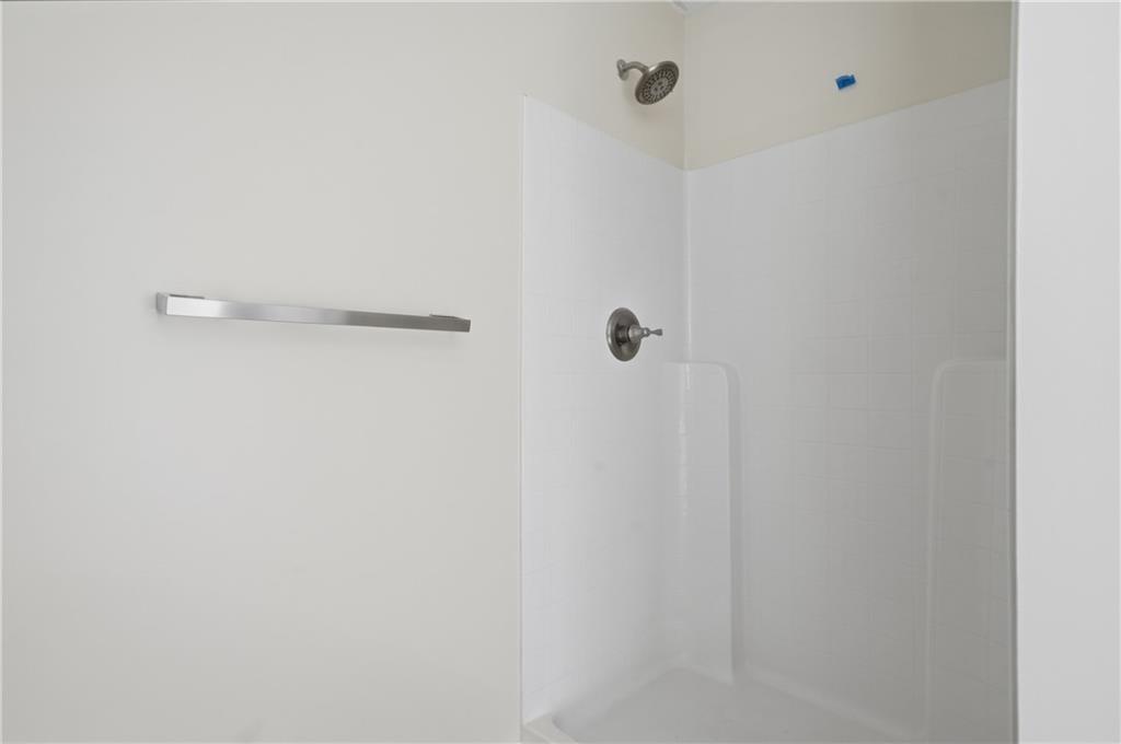 404 Sheila Way Canton, GA 30114 - Photo 18 of 36 a close view of a shower in bathroom