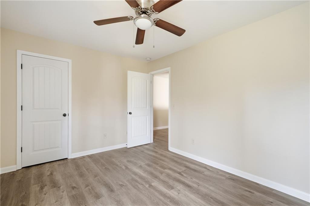 404 Sheila Way Canton, GA 30114 - Photo 22 of 36 a view of an empty room with wooden floor