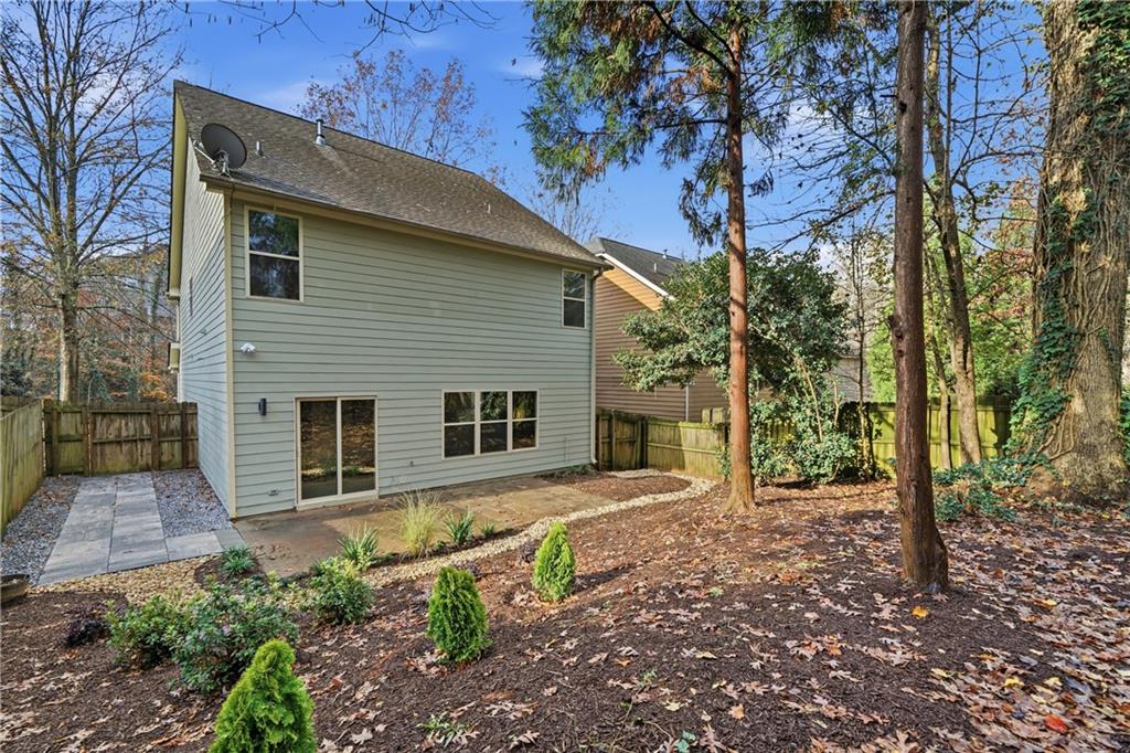 404 Sheila Way Canton, GA 30114 - Photo 25 of 36 a backyard of a house with seating space