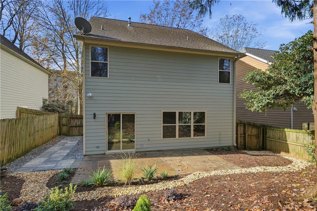 404 Sheila Way Canton, GA 30114 - Photo 26 of 36 a front view of a house with a yard