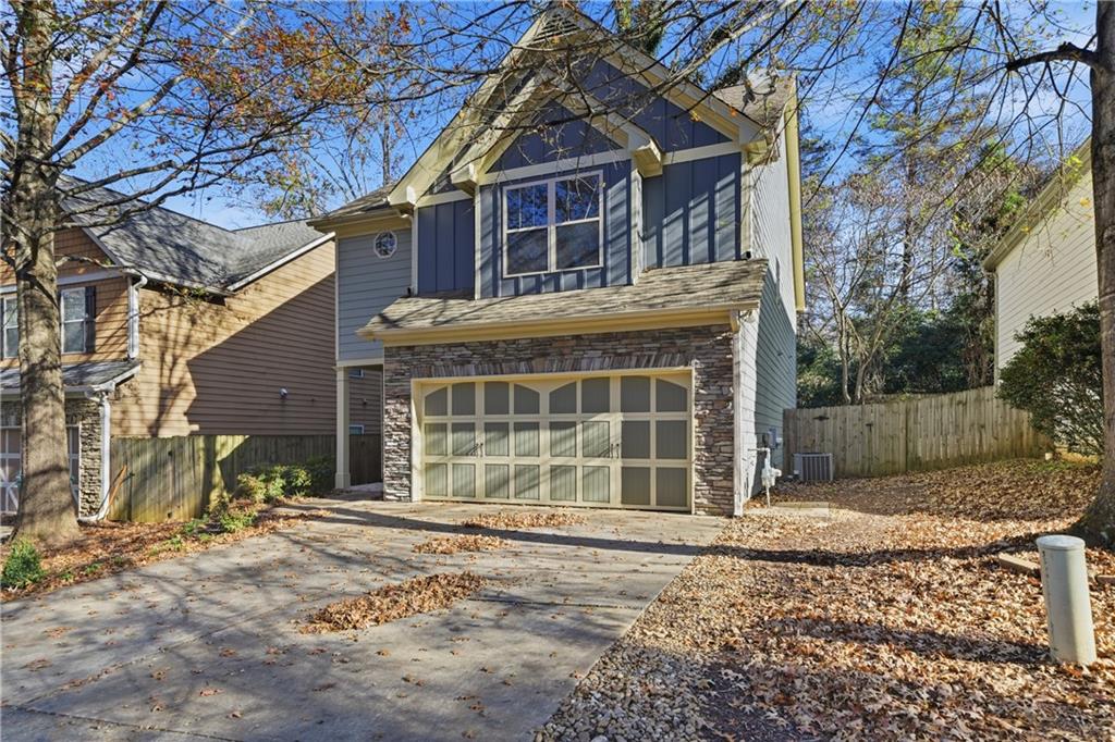 404 Sheila Way Canton, GA 30114 - Photo 32 of 36 a front view of a house with a yard