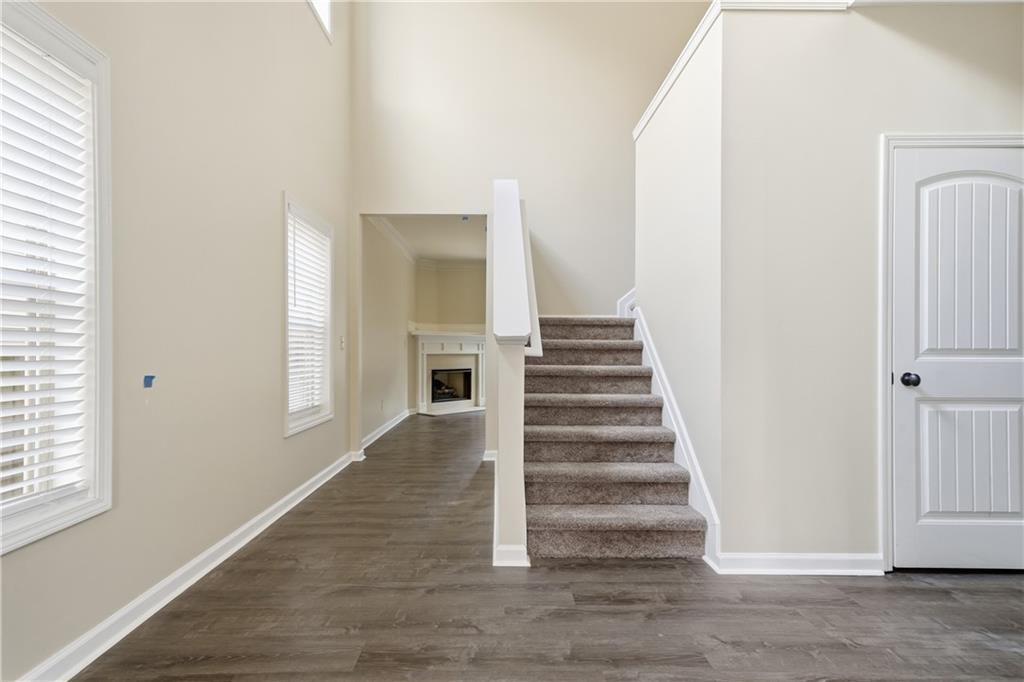 404 Sheila Way Canton, GA 30114 - Photo 4 of 36 a view of entryway and hall with wooden floor