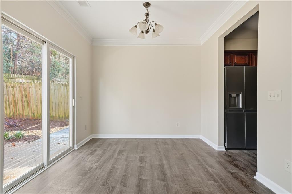 404 Sheila Way Canton, GA 30114 - Photo 8 of 36 a view of a livingroom with wooden floor and windows