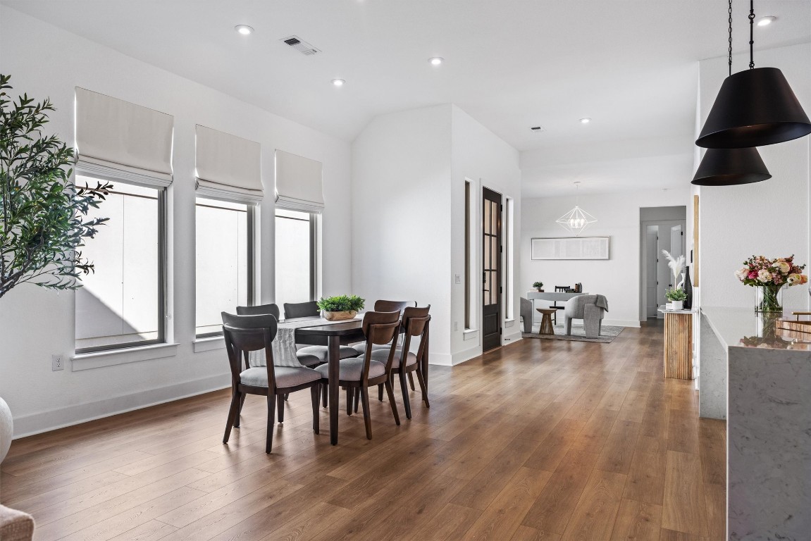 1122 Silver Dollar Trail Georgetown, TX 78628 - Photo 11 of 35 a dining room with furniture and wooden floor