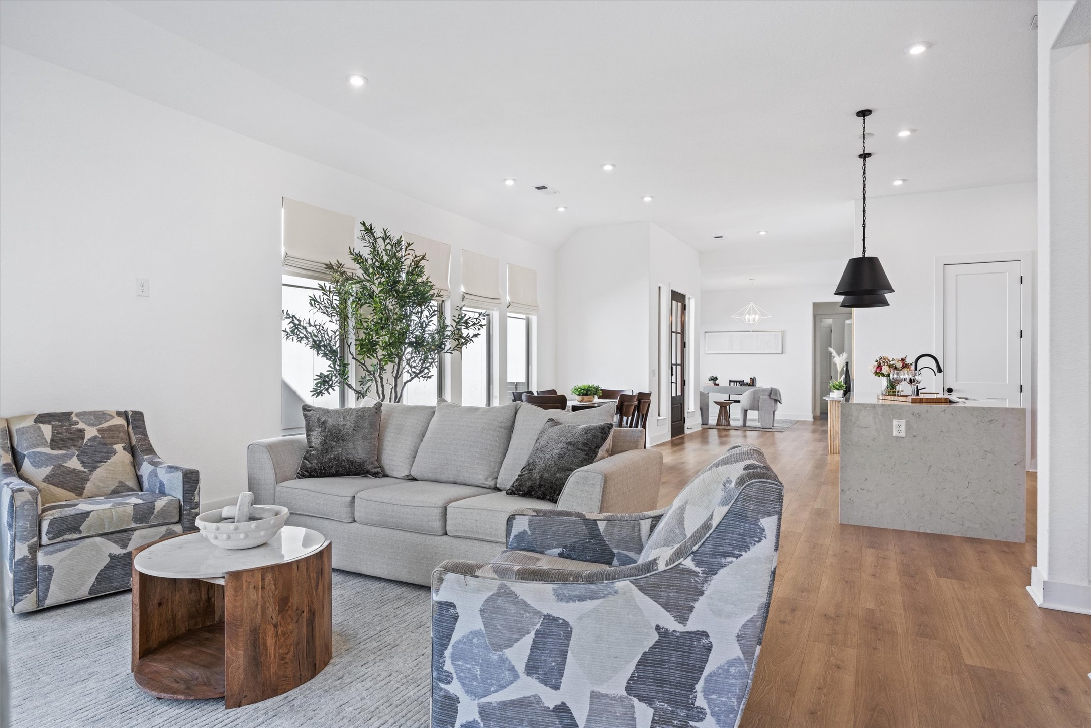 1122 Silver Dollar Trail Georgetown, TX 78628 - Photo 15 of 35 a living room with furniture and a wooden floor