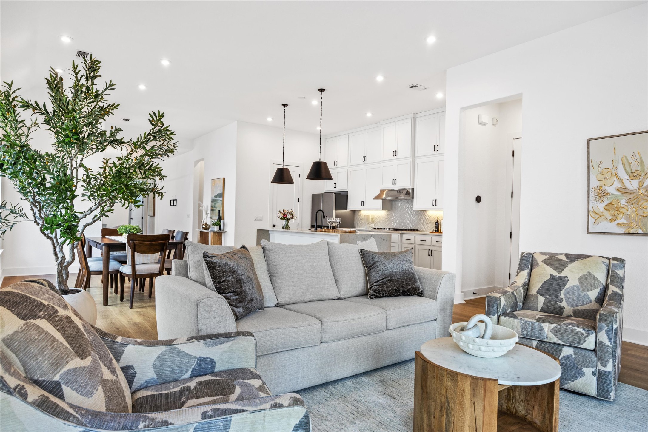 1122 Silver Dollar Trail Georgetown, TX 78628 - Photo 16 of 35 a living room with furniture kitchen and a potted plant