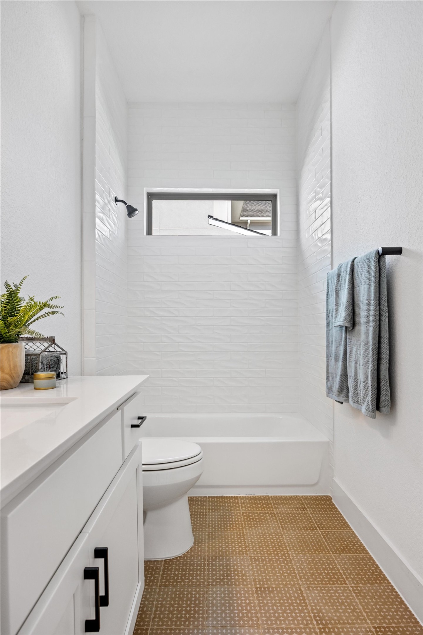 1122 Silver Dollar Trail Georgetown, TX 78628 - Photo 18 of 35 a bathroom with a sink a toilet and shower
