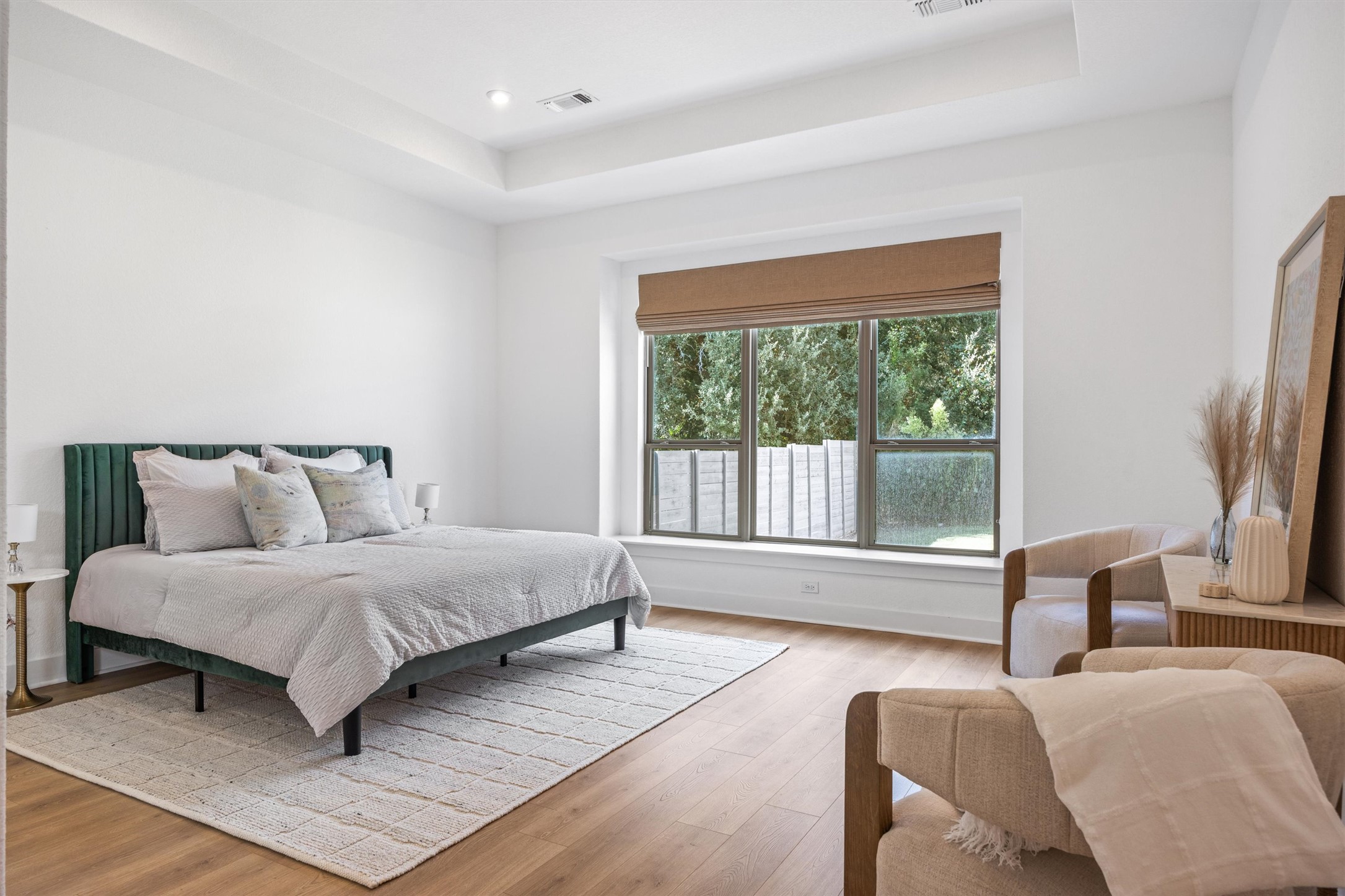 1122 Silver Dollar Trail Georgetown, TX 78628 - Photo 20 of 35 a spacious bedroom with a bed and glass window