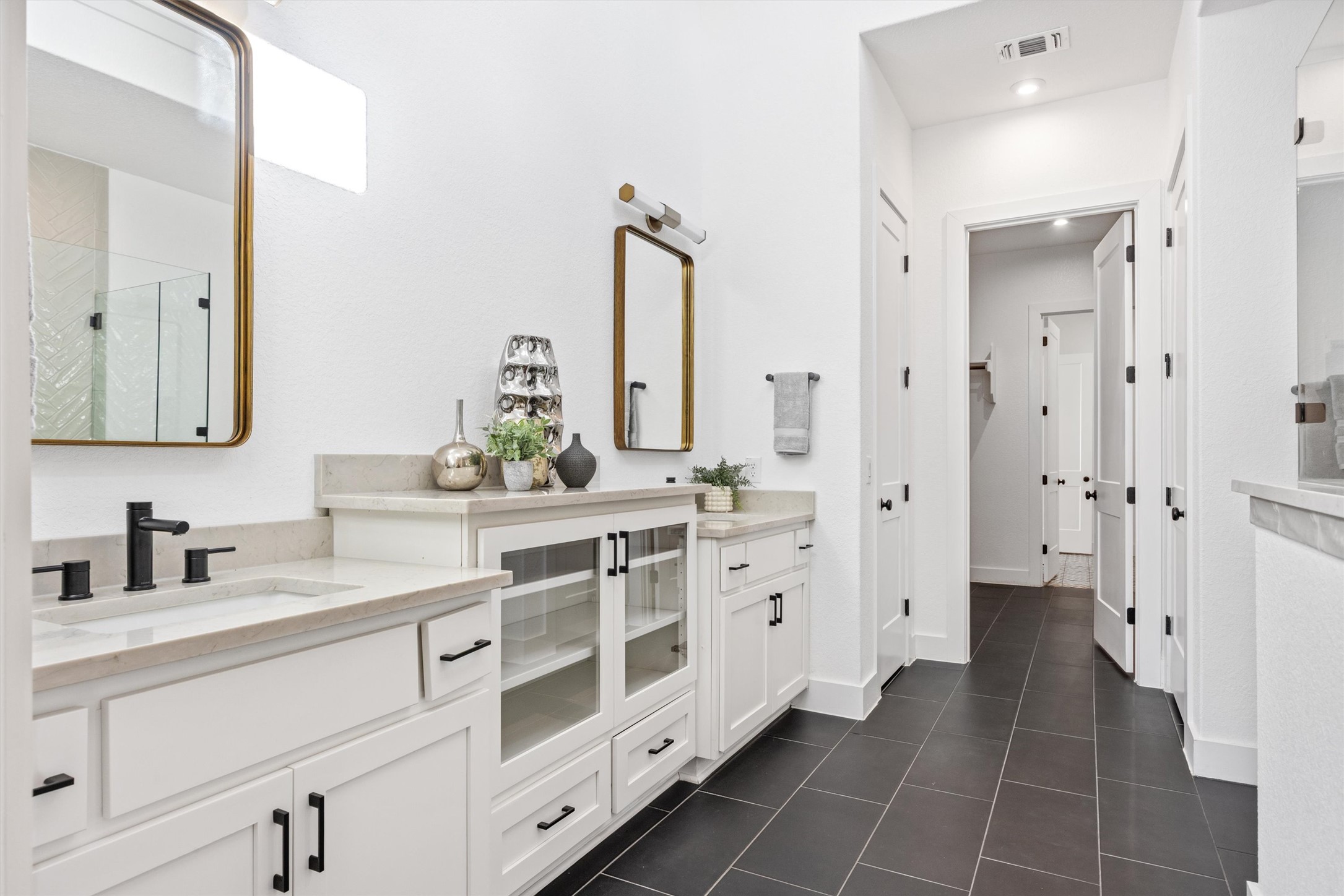 1122 Silver Dollar Trail Georgetown, TX 78628 - Photo 22 of 35 a bathroom with a double vanity sink mirror and