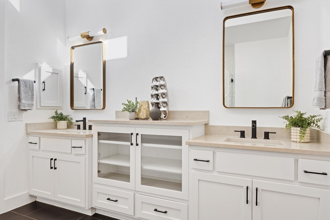 1122 Silver Dollar Trail Georgetown, TX 78628 - Photo 23 of 35 a bathroom with a sink vanity and mirror