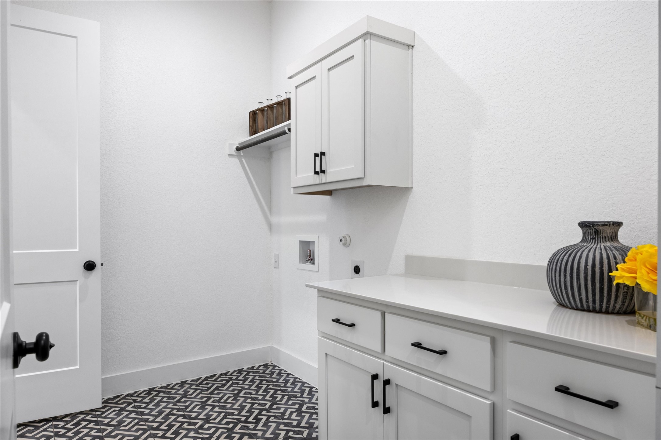 1122 Silver Dollar Trail Georgetown, TX 78628 - Photo 27 of 35 a kitchen with white cabinets and sink