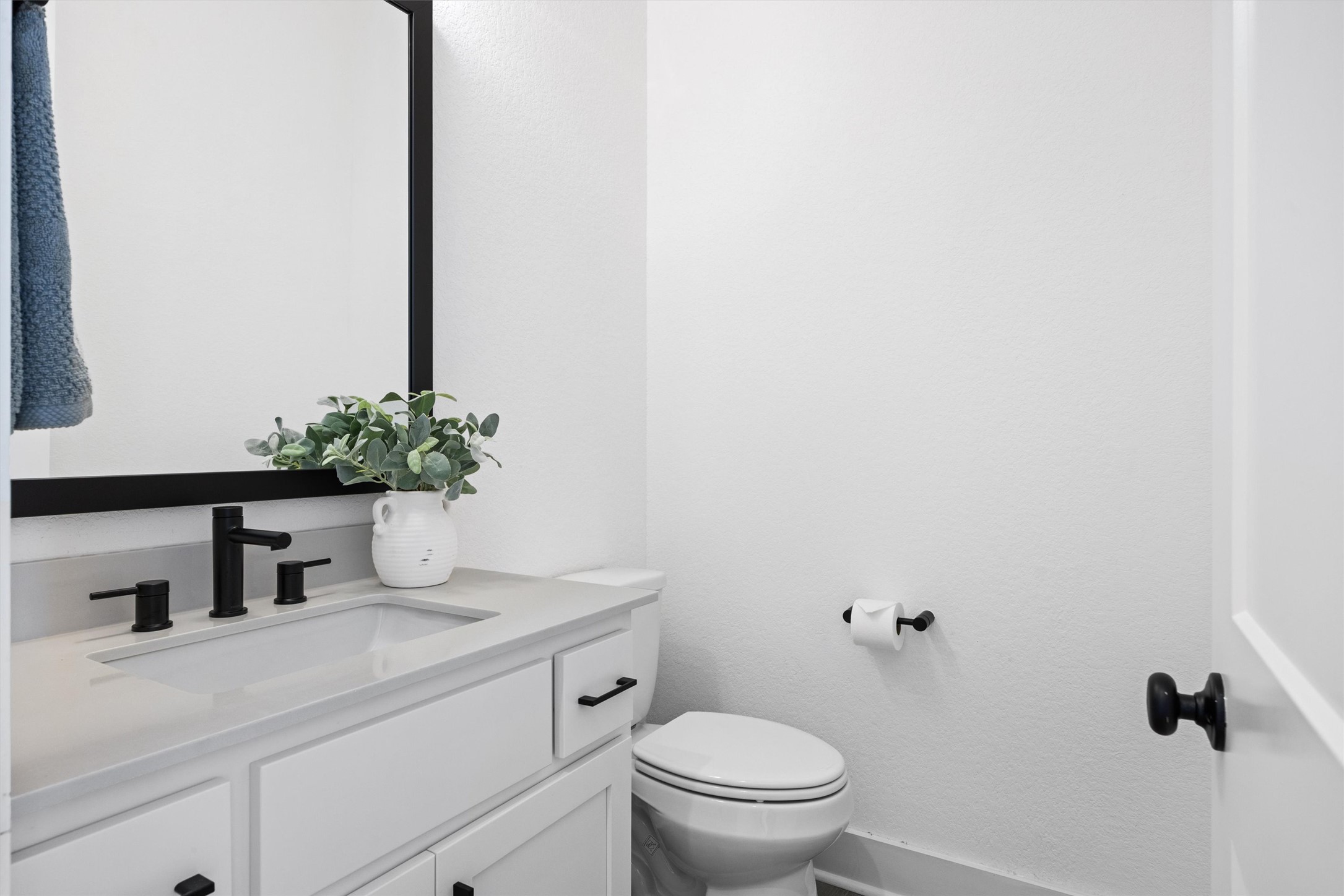 1122 Silver Dollar Trail Georgetown, TX 78628 - Photo 28 of 35 a bathroom with a sink a toilet and a mirror
