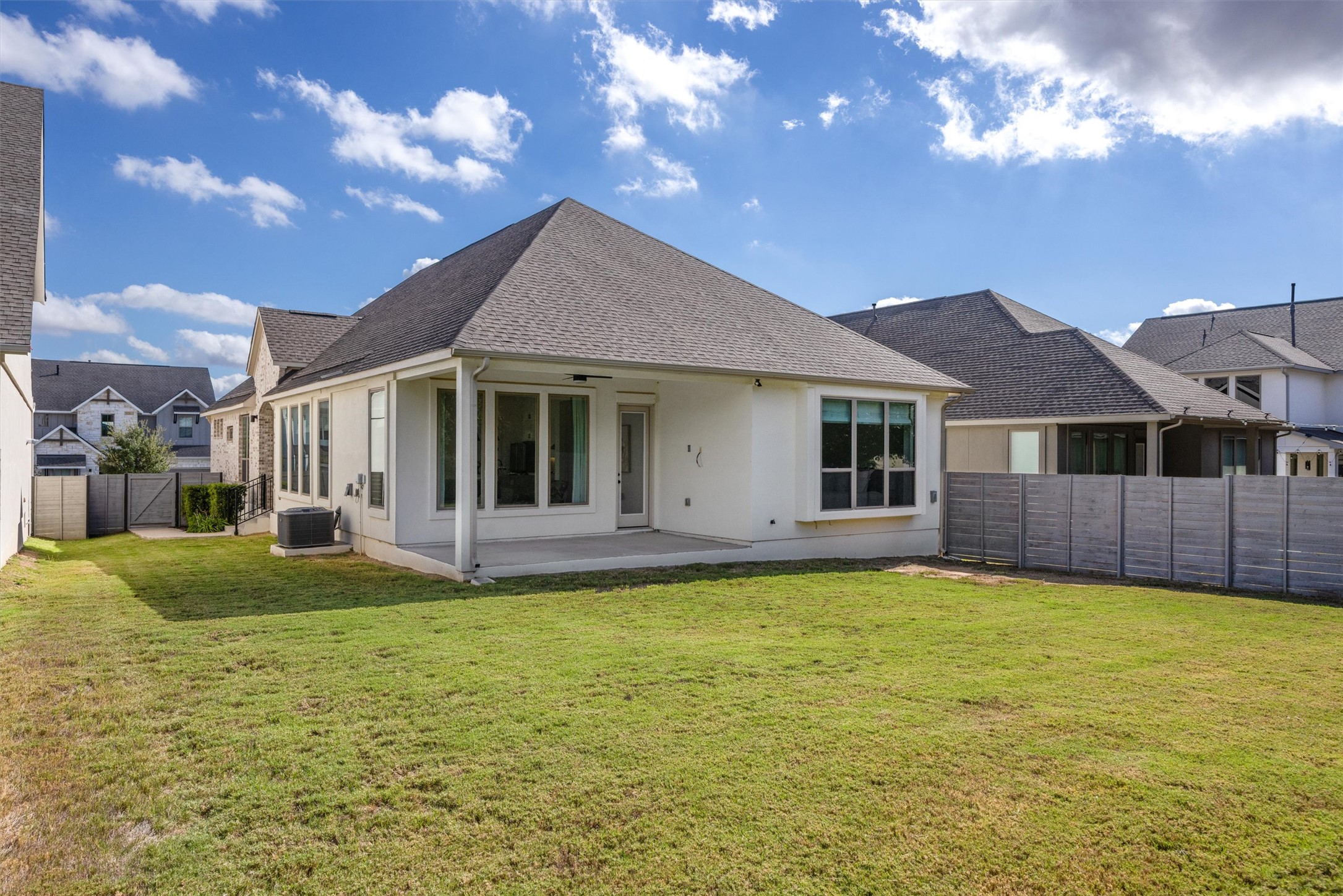 1122 Silver Dollar Trail Georgetown, TX 78628 - Photo 31 of 35 a view of a house with a swimming pool and a yard